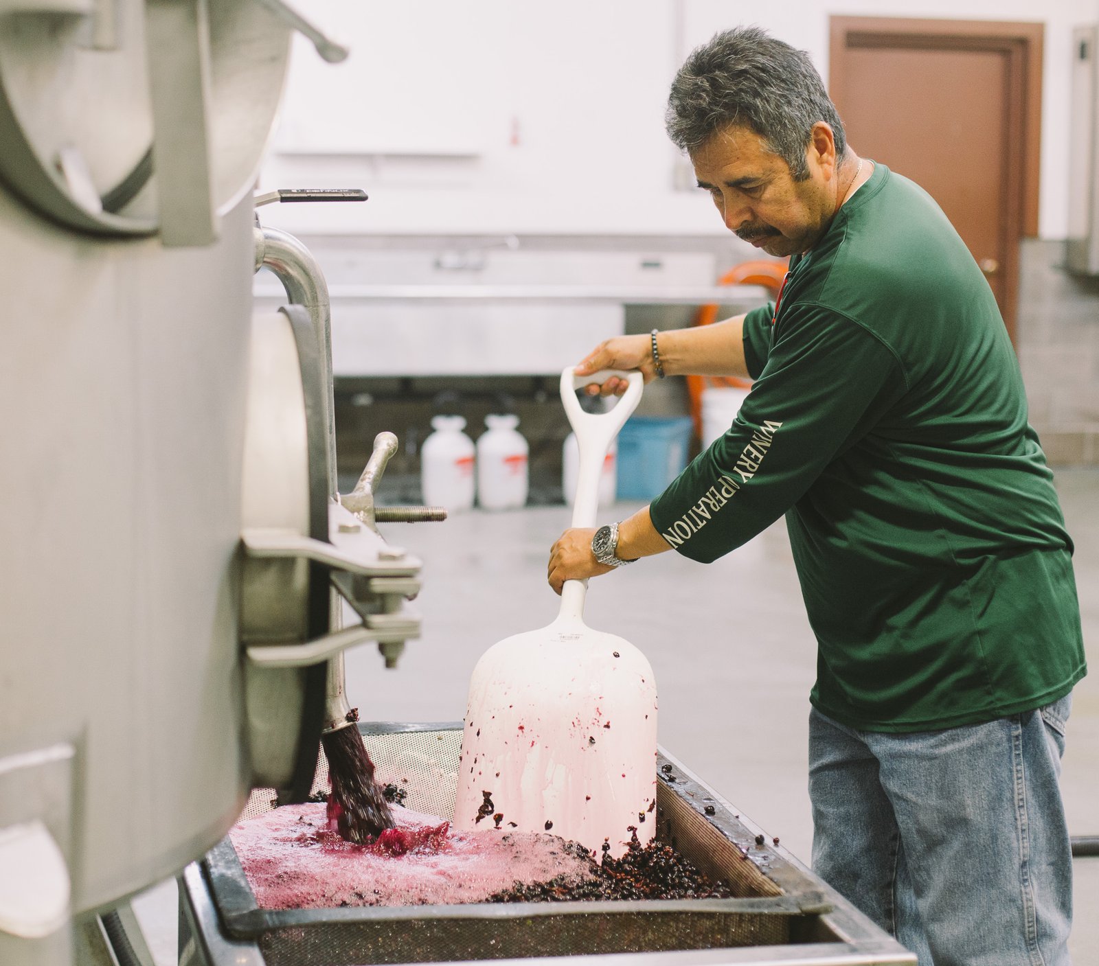 Man working with the custom crush equipment